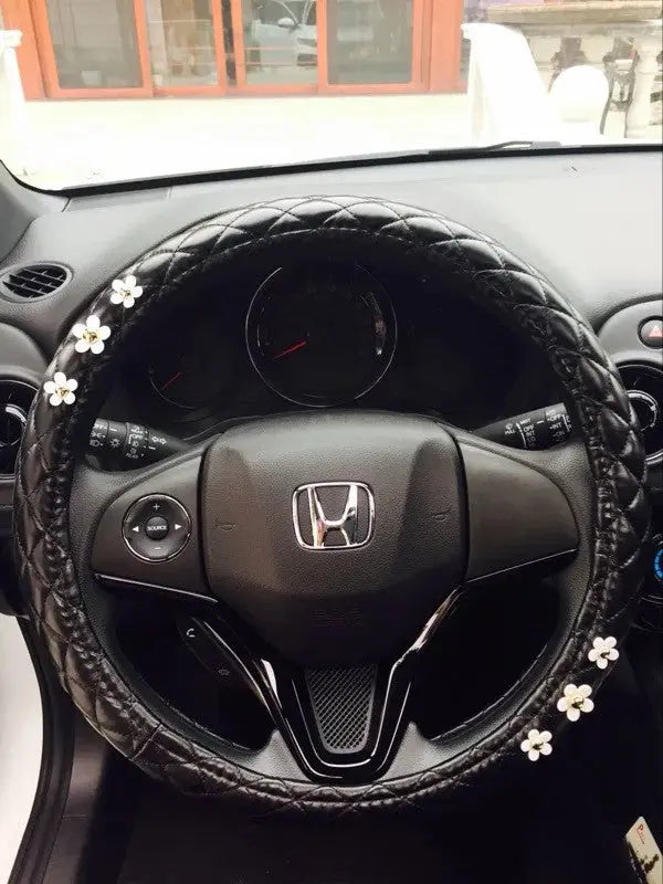 Housse De Volant Noir En Cuir Avec Motif Marguerite - ConfortVoiture.fr