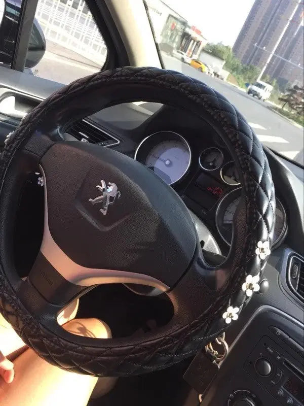 Housse De Volant Noir En Cuir Avec Motif Marguerite - ConfortVoiture.fr
